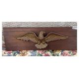 METAL EAGLE ON A WOOD PLAQUE