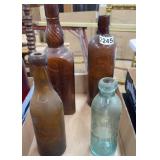 4 ANTIQUE EMBOSSED ADVERTISING BOTTLES