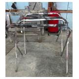 Couple of aluminum paint stands & (2) Wooden Saw
