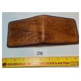 Vintage tooled leather bifold wallet; has the