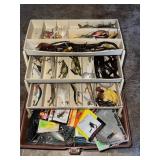 Vintage tackle box full of lures, many of which