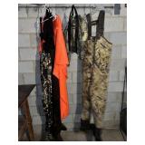 Hip waders, orange poncho