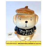A dog cookie jar - it says sweet tooth - Located