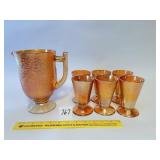 A vintage marigold glass pitcher and cup set -