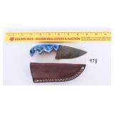 A blue handled Damascus blade knife with sheath