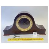 An antique mantel clock. Does have a key. -