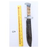A large knife has an eagle head on the handle,