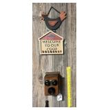 A pair of wall hangings includes a decorative