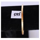 A bracelet marked 14K