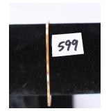 A bracelet marked 14K