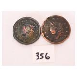Two large one cent coins. The dates are not