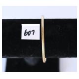 A bracelet marked 10K there are other initials