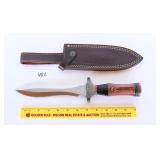 A large knife with sheath