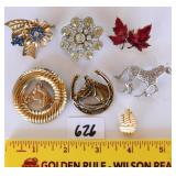 A group lot of costume jewelry brooches
