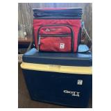 A Gott 34 cooler and an Ozark trail cooler bag