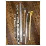 Levels, a sledge, an axe and some steel rules -