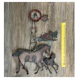 A matching pair of decorative metal horse wall