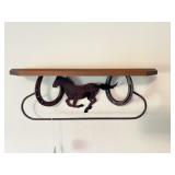 A horse themed shelf Measures approximately 18