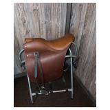 A leather saddle - the saddle stand is included