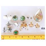 An assortment of jewelry. Includes some earrings,