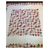 A large quilt. It measures approximately 86 x 85.