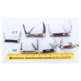 An assortment of pocket knives they all show some