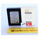 A Zippo lighter appears to be new old stock it