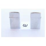 Pair of Zippo lighters both show some wear