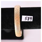 A gold bracelet marked 10K