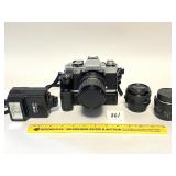 A Minolta film camera XG-M. It comes with extra