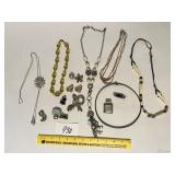 An assortment of jewelry - Located in Kitchen
