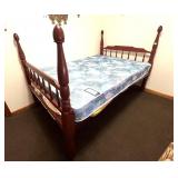 A vintage wooden bed. It measures approx. 52