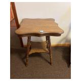 An oak parlor table. Measures approx. 29 inches