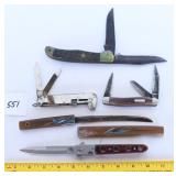 A group lot of knives including a large knife two