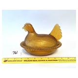 A vintage Indiana glass amber hen on the nest -