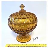 A vintage amber glass candy dish. It does have a