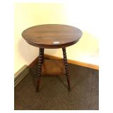 A vintage round top parlor or lamp table. 28