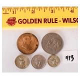 Group lot of coins, some appear to be silver.