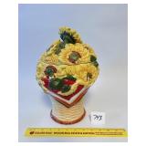 A Sunflower cookie jar. has some chips including