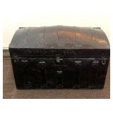 An antique camel back trunk. The measures