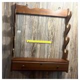A vintage wooden gun rack - Located in Hallway