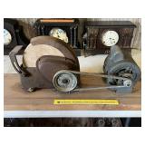 A vintage grinding wheel. It is hooked up to a