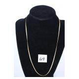 A necklace. It is marked 1/20 12K GF