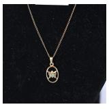 A necklace. The clasp is marked 1/20th 12 karat