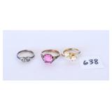 Three rings. The ring on the left is marked 925