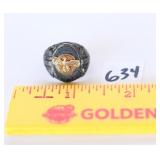 A large ring with an eagle on it is marked