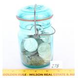A vintage blue jar with lid and also included are