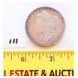 Morgan silver dollar 1878 - seven feathers