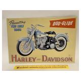 A metal Harley Davidson sign. It is newer