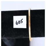 A bracelet marked 10K. has other initials but